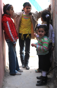 A group of girls talk together in an alleyway in the Dheisheh Refugee Camp. Bethlehem, 2011. credit: Mateo Hoke/Cate Malek